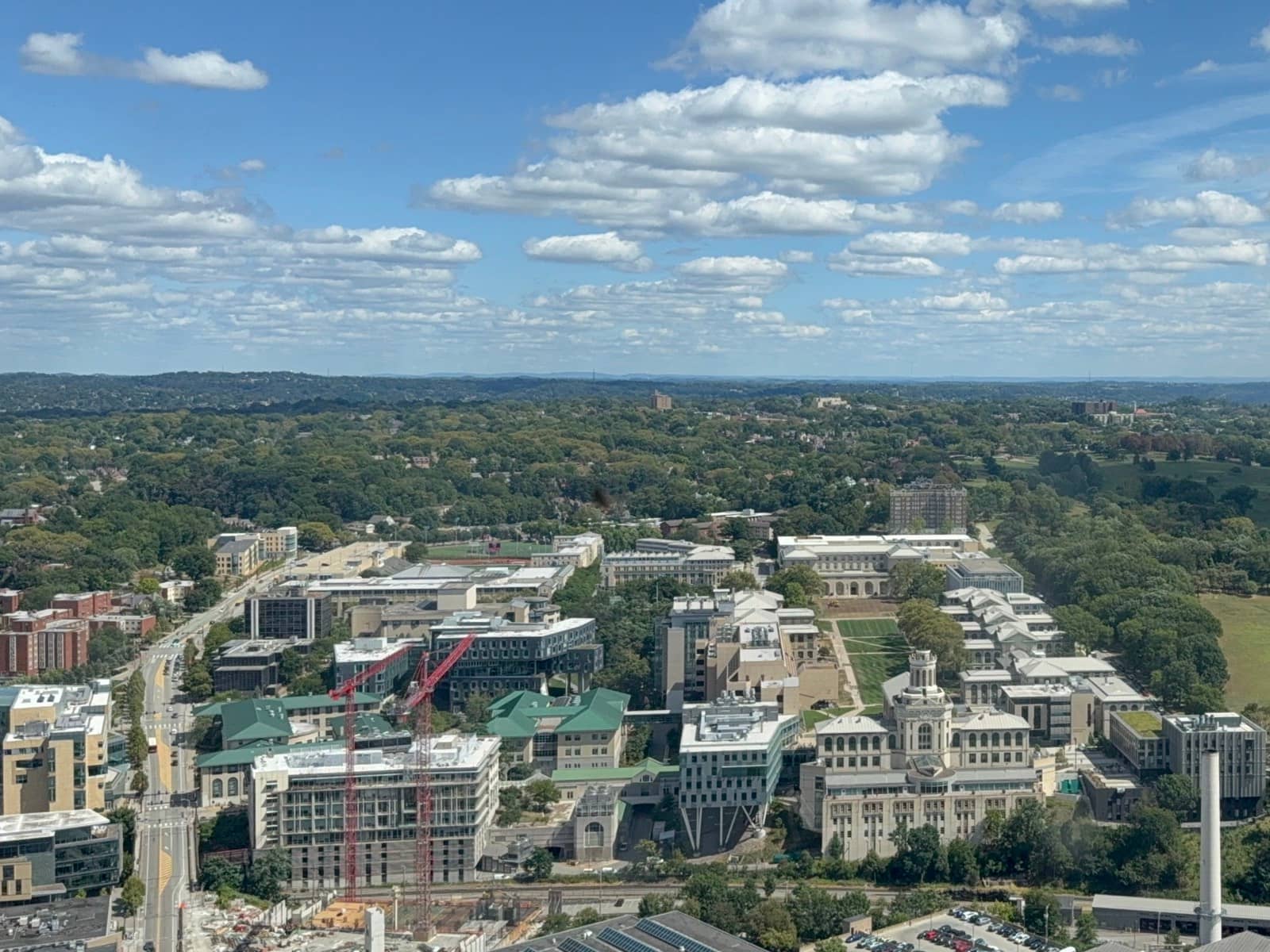 The Carnegie Mellon campus from above on a clear day, the halls and the Mall lawn among trees